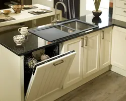 Built-in dishwasher in the kitchen interior photo