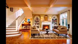 Photo Of The Living Room Interior With A Fireplace And Staircase