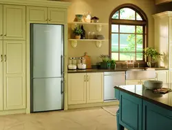Refrigerator in a niche in the kitchen interior photo