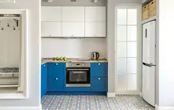 Refrigerator in a niche in the kitchen interior photo