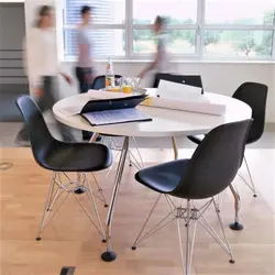 White Table And Black Chairs For The Kitchen Photo