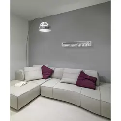 Sconce on the wall in the living room above the sofa photo