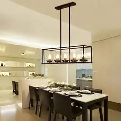 Hanging lamps above the bar counter in the kitchen photo