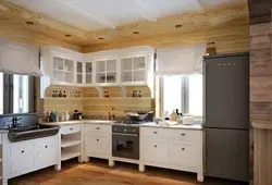 Corner kitchens in a wooden house with a window photo