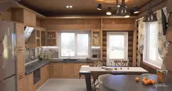Corner kitchens in a wooden house with a window photo