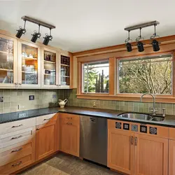 Corner kitchens in a wooden house with a window photo