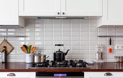 Kitchen apron made of white brick tiles photo