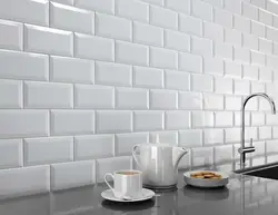 Kitchen apron made of white brick tiles photo