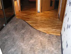 Photo transition of tiles to laminate in the hallway photo