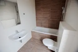 Tiles under laminate in the bathroom photo on the wall