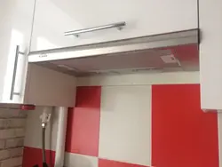 Built-in kitchen hood with ventilation outlet photo