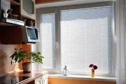 Blinds and curtains on one window in the kitchen photo
