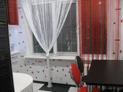 Blinds and curtains on one window in the kitchen photo