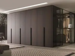 Wardrobe to the ceiling with hinged doors to the bedroom photo