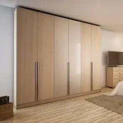 Wardrobe to the ceiling with hinged doors to the bedroom photo