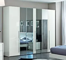 Wardrobe With Hinged Doors And Mirror In The Bedroom Photo