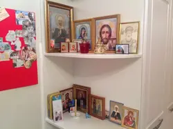 In which corner do they hang icons in the house in the bedroom photo