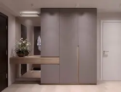 Hallway in a modern style with a wardrobe and a soft seat photo
