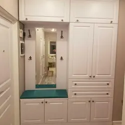 Hallway in a modern style with a wardrobe and a soft seat photo