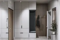 Hallway in a modern style with a wardrobe and a soft seat photo