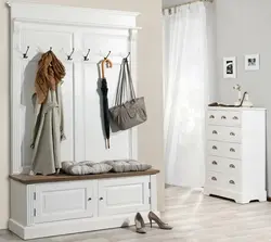 Hallway closet with shoe rack, hanger and seat photo