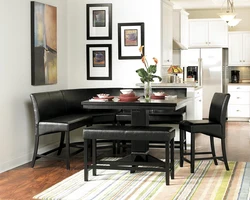 Black sofa in the kitchen interior