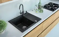 Gray sink in the kitchen interior