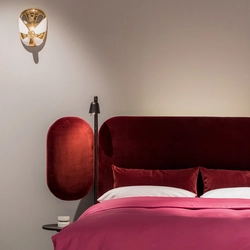 Burgundy bed in the bedroom interior