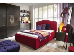 Burgundy bed in the bedroom interior