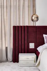 Burgundy bed in the bedroom interior