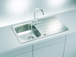 Stainless steel sink in the kitchen interior