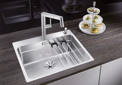 Stainless steel sink in the kitchen interior