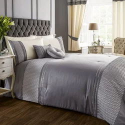 Gray bedspread in the bedroom interior