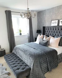 Gray bedspread in the bedroom interior