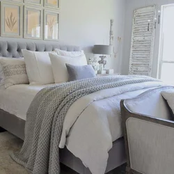 Gray bedspread in the bedroom interior