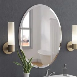 Oval mirror in the bathroom interior