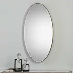 Oval mirror in the bathroom interior