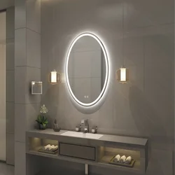 Oval mirror in the bathroom interior