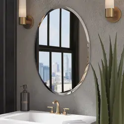 Oval mirror in the bathroom interior
