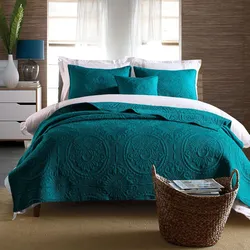 Turquoise bedspread in the bedroom interior