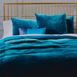 Turquoise bedspread in the bedroom interior
