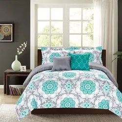 Turquoise bedspread in the bedroom interior
