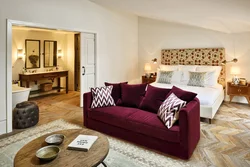 Crimson sofa in the living room interior