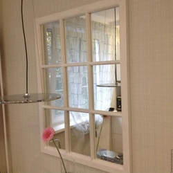 Mirror window in the kitchen interior