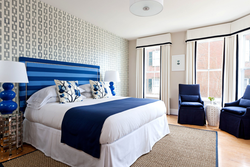 Bedroom interior with blue bedspread