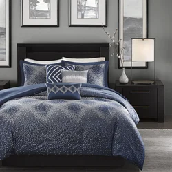 Blue bedspread in the bedroom interior