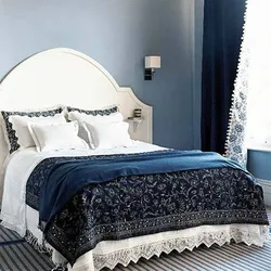 Blue bedspread in the bedroom interior