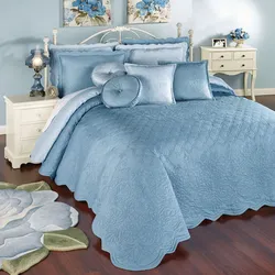 Blue bedspread in the bedroom interior