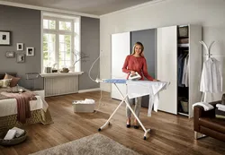 Ironing board in the bedroom interior