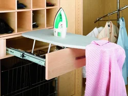 Ironing board in the bedroom interior